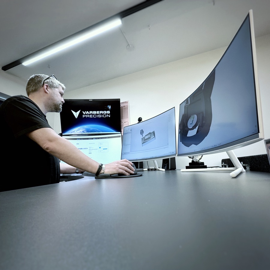 Engineer developing a component at a CAD workstation